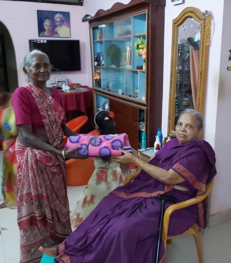 Former School Teacher,Mummy Peddoju,Gives a Sari to Gangamma, our Teachers Aide at the School Since It's 2009 Opening